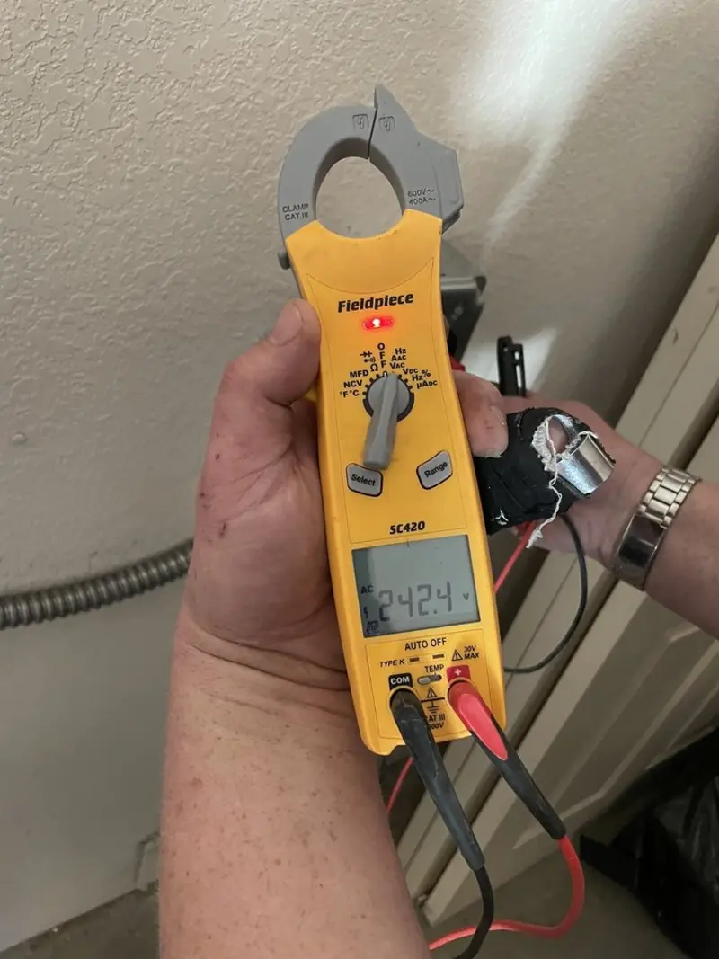 Voltage testing with clamp meter during Electrical Installation Services in Mount Vernon